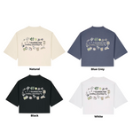 Four t-shirts in different colors with a design on the back against a white background.